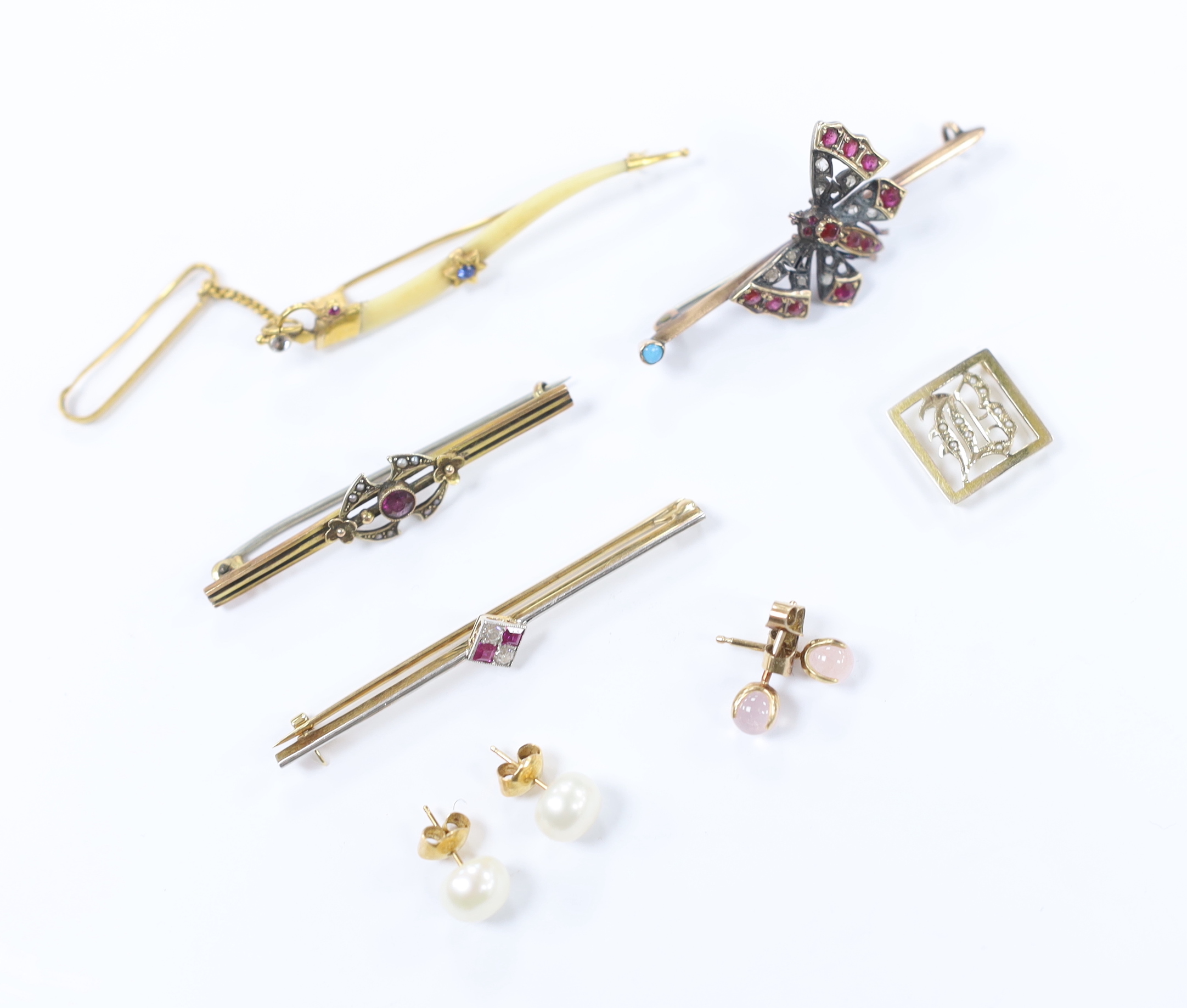 Four assorted yellow metal and gem set bar brooches, including a ruby and diamond four stone set, 56mm and a Victorian yellow metal, rose cut diamond and gem set butterfly bar brooch, together with two pairs of ear studs